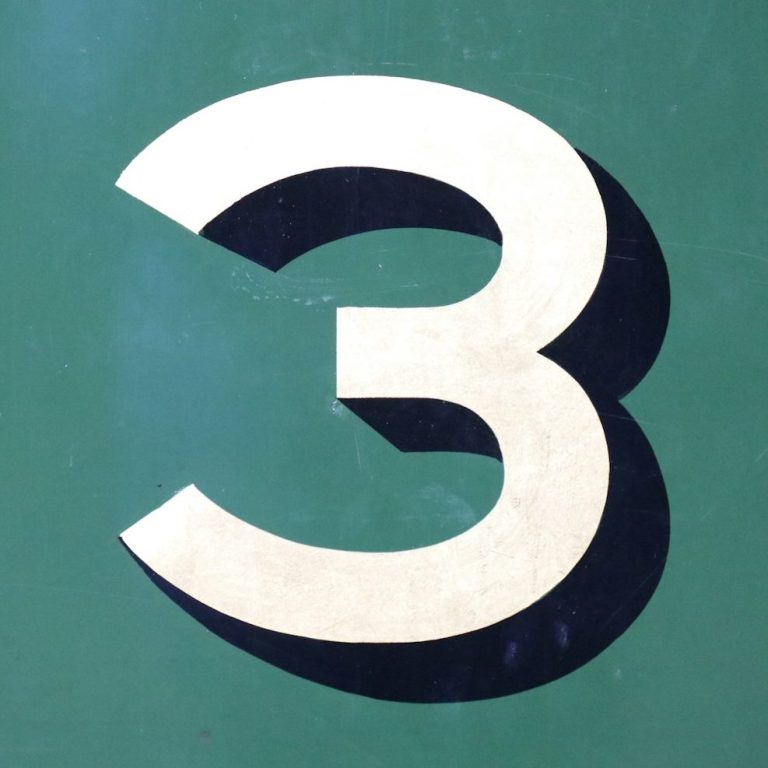 A photo of a hand-painted number three